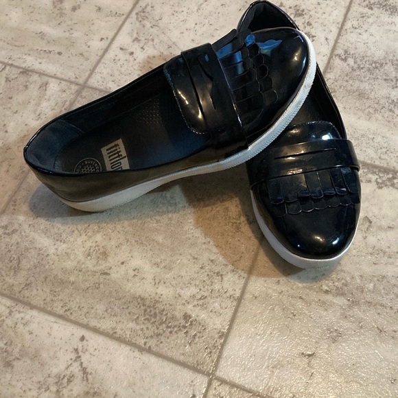 Fit flip black shiny frilly loafers style black shed with small mark on one toe. - Picture 2 of 10